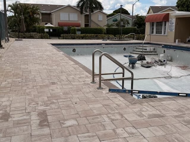 Crew at work resurfacing the West Pool
