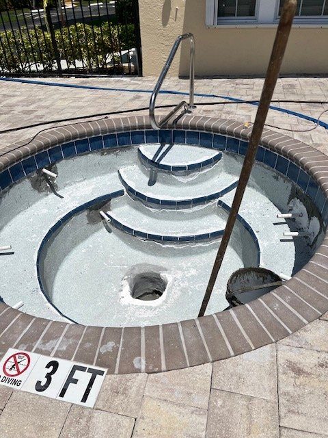 Resurfaced spa with new tile and steps